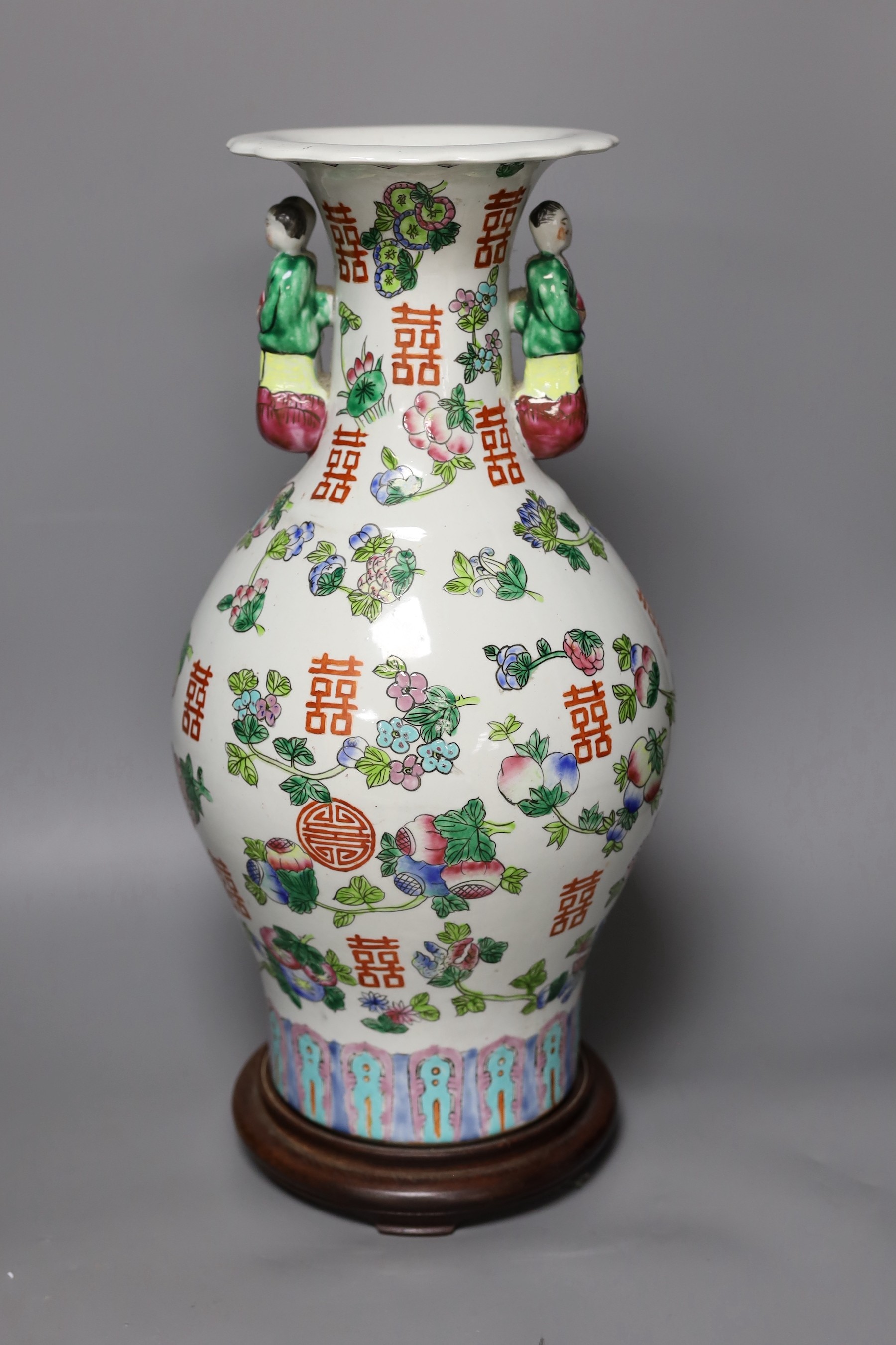 A Chinese famille rose vase, on plinth, 46 cms high